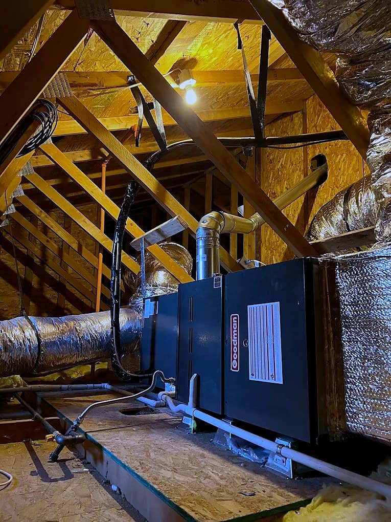 New air handler installed in an attic with insulated ductwork